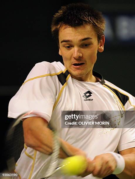 Andreas Beck of Germany plays a shot during his tennis match against France's Arnaud Clement in Stockholm on October 20, 2009 during the second day...