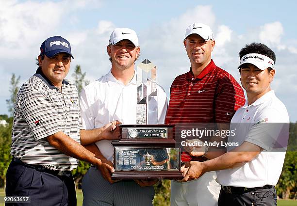 Angel Cabrera, Lucas Glover, Stewart Cink and Y.E. Yang hold the Grand Slam of Golf trophy before the first round of the PGA Grand Slam of Golf on...