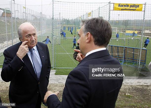 The President of the FIFA Sepp Blatter talks with former Hungarian Prime Minister Viktor Orban in the Puskas Ferenc Football Academy in Felcsut 80 km...