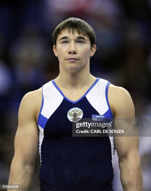 This file picture shows Russia's Yury Ryazanov standing on the podium after the men's individual all-around final during the Artistic Gymnastics...