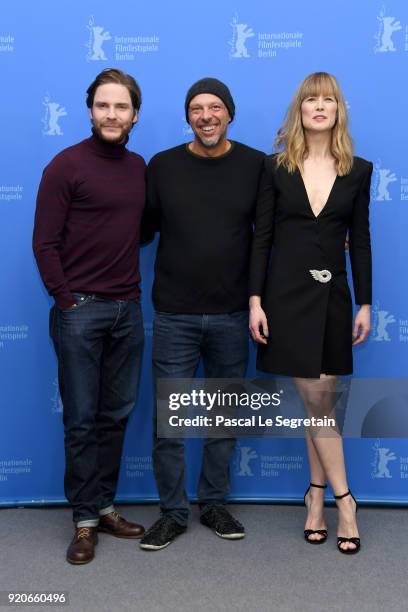 Daniel Bruehl, Jose Padilha and Rosamund Pike pose at the '7 Days in Entebbe' photo call during the 68th Berlinale International Film Festival Berlin...