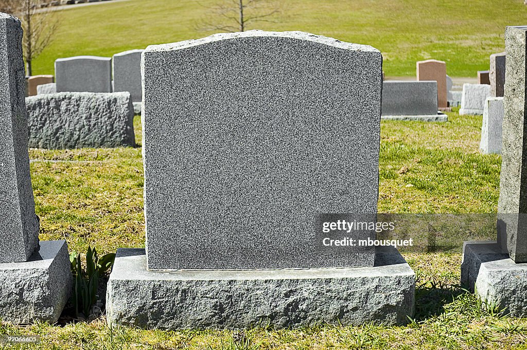 A blank tombstone in a cemetery