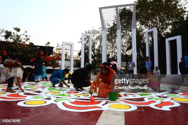 Bangladeshi fine arts students and teachers paints on the ground of the Central Shahid Minar , in Dhaka on February 19 as part of preparations for...