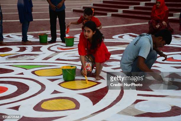 Bangladeshi fine arts students and teachers paints on the ground of the Central Shahid Minar , in Dhaka on February 19 as part of preparations for...