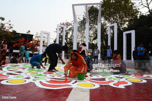 Bangladeshi fine arts students and teachers paints on the ground of the Central Shahid Minar , in Dhaka on February 19 as part of preparations for...