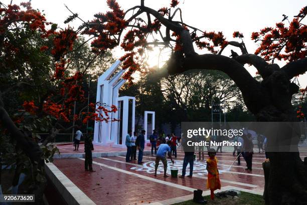 Bangladeshi fine arts students and teachers paints on the ground of the Central Shahid Minar , in Dhaka on February 19 as part of preparations for...