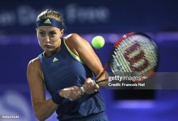 Kristina Mladenovic of France in action against Naomi Osaka of Japan during day one of the WTA Dubai Duty Free Tennis Championship at the Dubai...