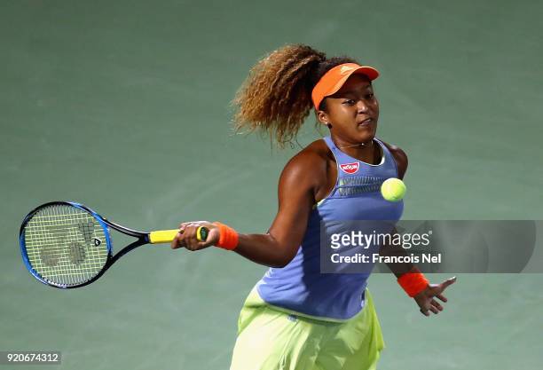 Naomi Osaka of Japan plays a forehand against Kristina Mladenovic of France during day one of the WTA Dubai Duty Free Tennis Championship at the...