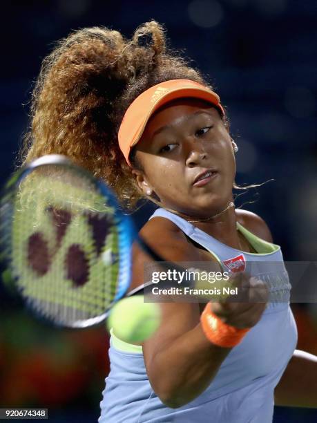 Naomi Osaka of Japan plays a forehand against Kristina Mladenovic of France during day one of the WTA Dubai Duty Free Tennis Championship at the...