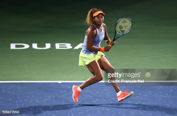 Naomi Osaka of Japan in action against Kristina Mladenovic of France during day one of the WTA Dubai Duty Free Tennis Championship at the Dubai...