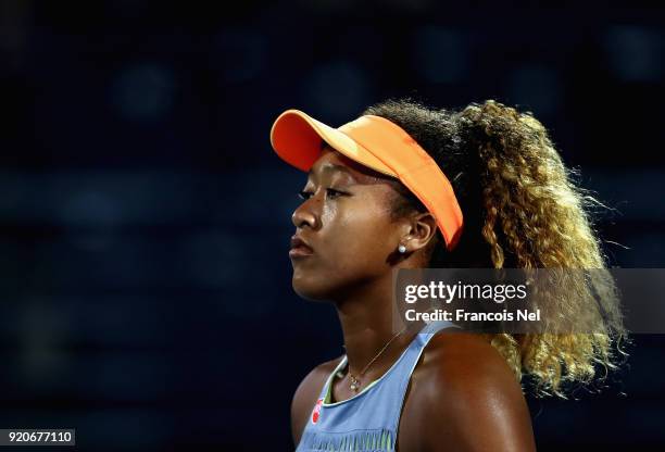 Naomi Osaka of Japan looks on against Kristina Mladenovic of France during day one of the WTA Dubai Duty Free Tennis Championship at the Dubai Tennis...