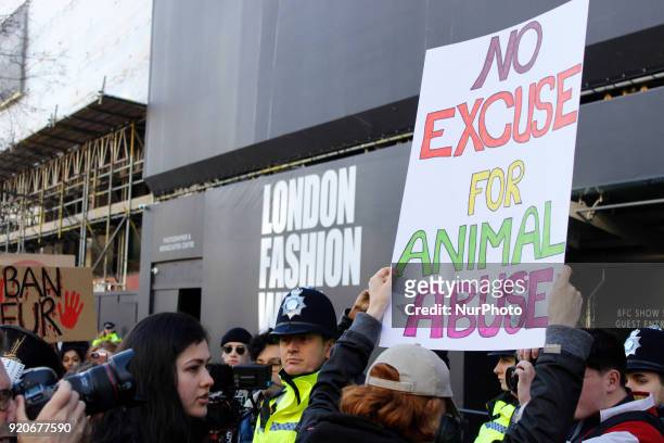 Protesters stand in front of British Fashion Council showspace during London Fashion Weak to draw public attention to use of fur in fashion industry...