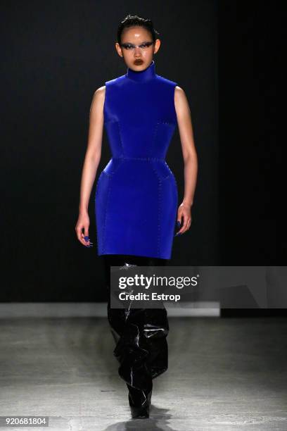 Model walks the runway at the Gareth Pugh show during London Fashion Week February 2018 at Ambika P3 on February 17, 2018 in London, England.