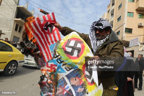 Burning pictures of the American president and the flag of America and Israel in front of the headquarters of the Red Cross in Gaza, Palestine, on 19...