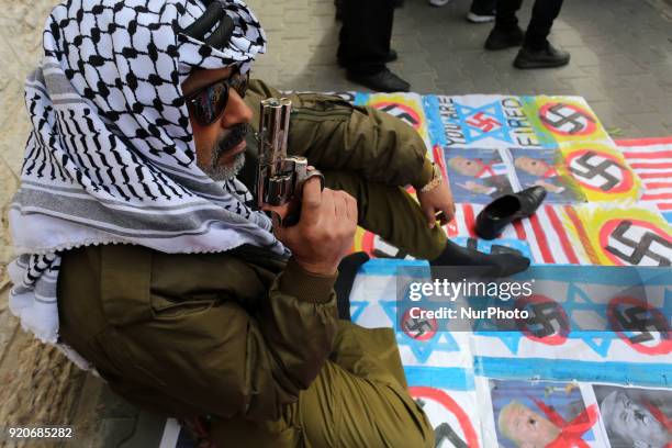 Burning pictures of the American president and the flag of America and Israel in front of the headquarters of the Red Cross in Gaza, Palestine, on 19...