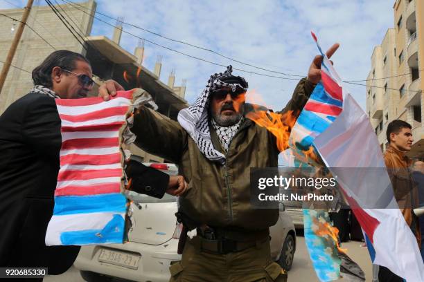 Burning pictures of the American president and the flag of America and Israel in front of the headquarters of the Red Cross in Gaza, Palestine, on 19...