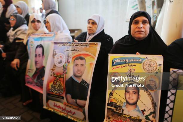 Palestinians hold poster of Ahed Tamimi during a protest to show solidarity with Palestinian prisoners held in Israeli jails, in front of Red cross...