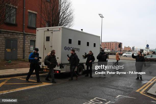 Photographers gather around a GEOAmey van leaving Liverpool Crown Court after the sentencing of serial paedophile Barry Bennell who has been branded...