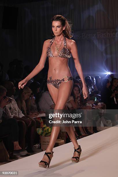 Model walks the runway at the Poko Pano 2010 fashion show during Mercedes-Benz Fashion Week Swim at The Oasis on July 18, 2009 in Miami, Florida.