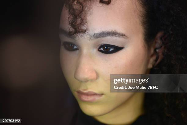 Model backstage ahead of the Paula Knorr Presentation during London Fashion Week February 2018 at BFC Show Space on February 19, 2018 in London,...