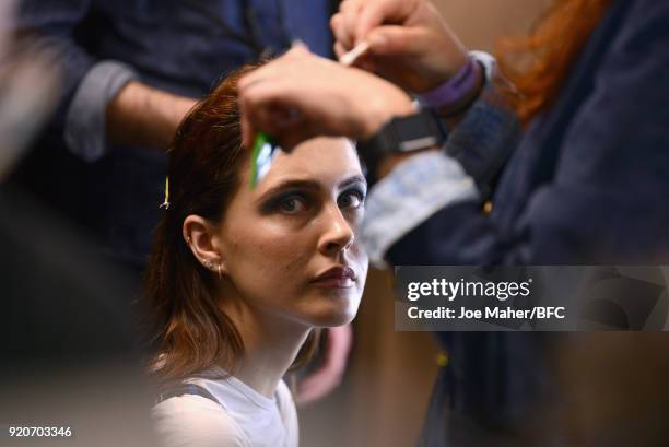 Model has their hair styled backstage ahead of the Paula Knorr Presentation during London Fashion Week February 2018 at BFC Show Space on February...