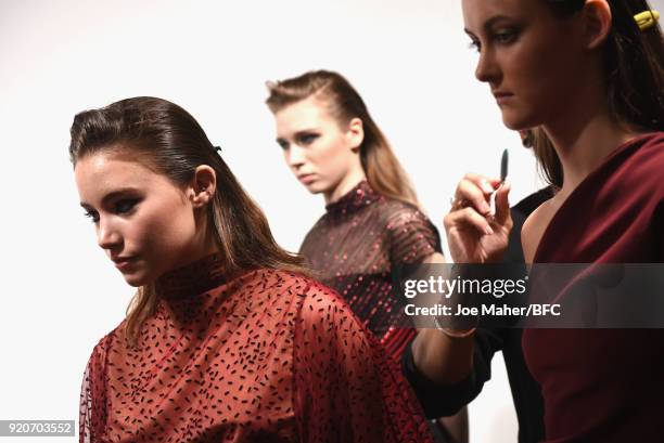 Models backstage ahead of the Paula Knorr Presentation during London Fashion Week February 2018 at BFC Show Space on February 19, 2018 in London,...