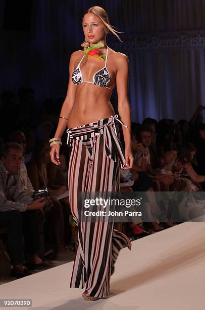 Model walks the runway at the Poko Pano 2010 fashion show during Mercedes-Benz Fashion Week Swim at The Oasis on July 18, 2009 in Miami, Florida.