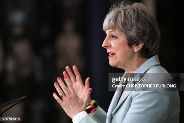 Britain's Prime Minister Theresa May delivers a speech on education at Derby College in Derby, northern England on February 19, 2018 to launch a...