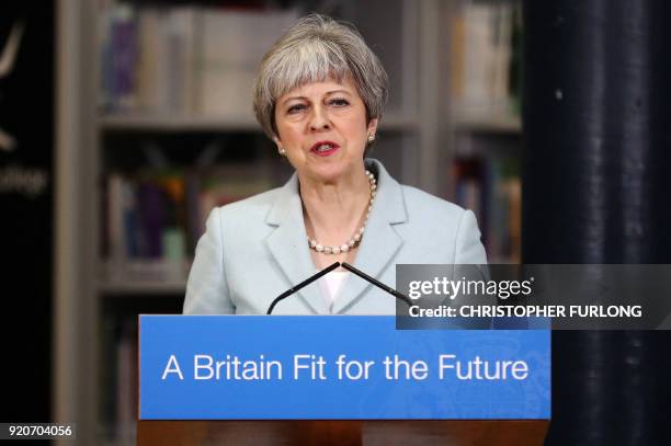 Britain's Prime Minister Theresa May delivers a speech on education at Derby College in Derby, northern England on February 19, 2018 to launch a...