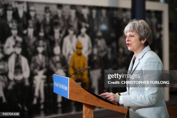 Britain's Prime Minister Theresa May delivers a speech on education at Derby College in Derby, northern England on February 19, 2018 to launch a...