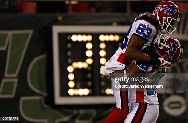 Lee Evans and Fred Jackson of the Buffalo Bills celebrate in the endzone after Evans' touchdown in the third quarter of the game on October 18, 2009...