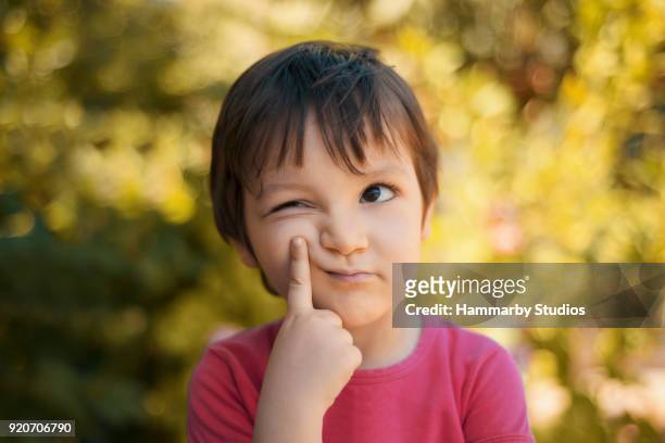 close-up portrait of thinking little girl looking away with thoughtful facial expression - suspicion stock pictures, royalty-free photos & images