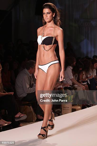 Model walks the runway at the Poko Pano 2010 fashion show during Mercedes-Benz Fashion Week Swim at The Oasis on July 18, 2009 in Miami, Florida.