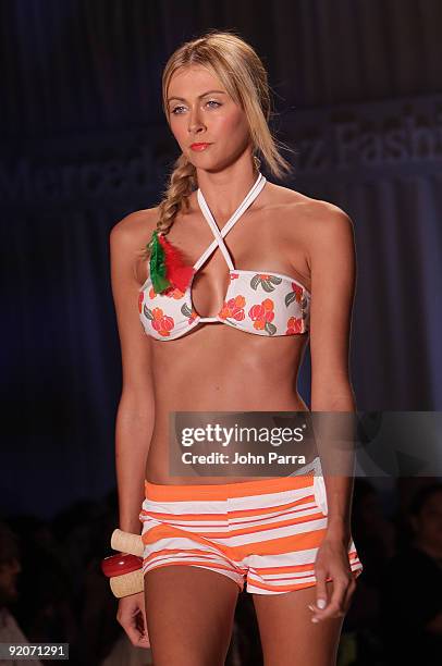 Model walks the runway at the Poko Pano 2010 fashion show during Mercedes-Benz Fashion Week Swim at The Oasis on July 18, 2009 in Miami, Florida.