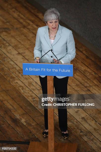 Britain's Prime Minister Theresa May delivers a speech on education at Derby College in Derby, northern England on February 19, 2018 to launch a...