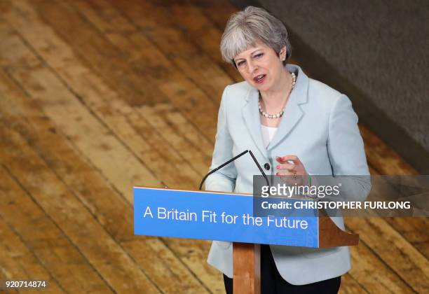 Britain's Prime Minister Theresa May delivers a speech on education at Derby College in Derby, northern England on February 19, 2018 to launch a...