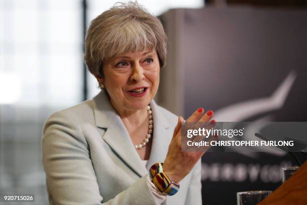 Britain's Prime Minister Theresa May delivers a speech on education at Derby College in Derby, northern England on February 19, 2018 to launch a...