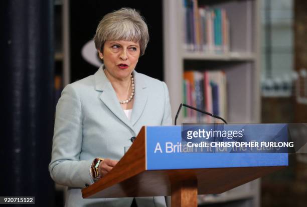 Britain's Prime Minister Theresa May delivers a speech on education at Derby College in Derby, northern England on February 19, 2018 to launch a...