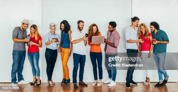 people using modern technology - laptops in a row stock pictures, royalty-free photos & images