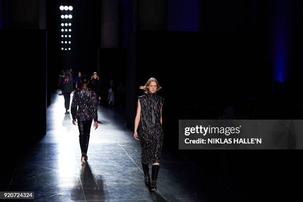 Models present creations from designer Christopher Kane during their catwalk show on the fourth day of London Fashion Week Autumn/Winter 2018 in...