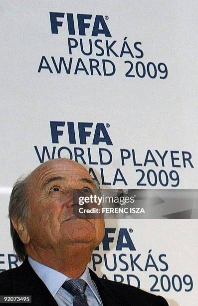 President of the FIFA Joseph S. Blatter listens to the speech of the former Hungarian Prime Minister Viktor Orban in the Puskas Ferenc Football...