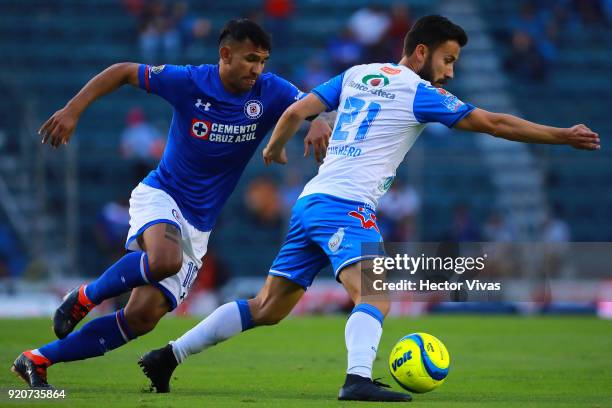 Walter Montoya of Cruz Azul struggles for the ball with Jose Guerrero of Puebla during the 8th round match between Cruz Azul and Puebla as part of...