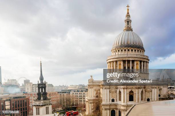 london skyline with dome of st paul's cathedral on a cloudy day - st paul's cathedral london stock-fotos und bilder