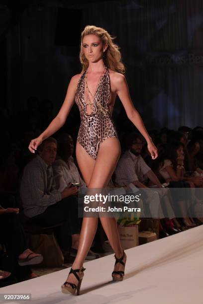 Model walks the runway at the Poko Pano 2010 fashion show during Mercedes-Benz Fashion Week Swim at The Oasis on July 18, 2009 in Miami, Florida.