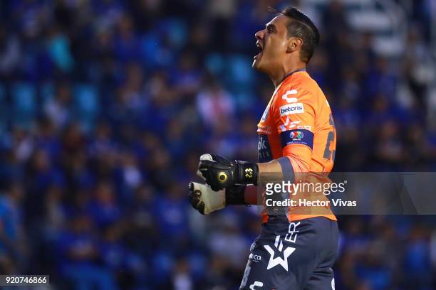 Moises Munoz goalkeeper of Puebla celebrates after teammate Francisco Acuña scored the equalizer during the 8th round match between Cruz Azul and...
