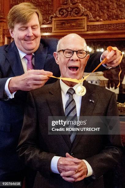 Dutch choreographer Hans van Manen reacts as he receives a honorary medal of Art and Science of the Order of the House of Orange from Dutch king...