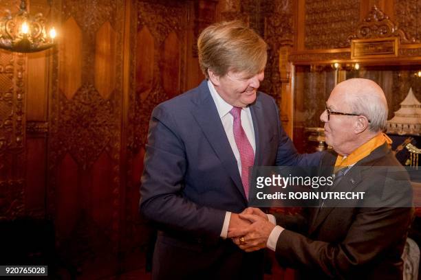 Dutch choreographer Hans van Manen shakes hands with Dutch king Willem-Alexander, after he received a honorary medal of Art and Science of the Order...