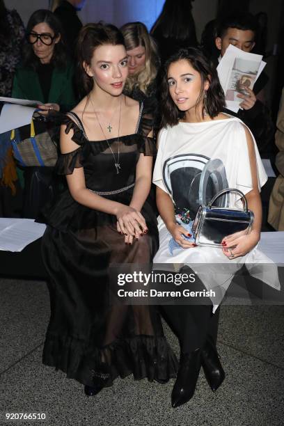 Anya Taylor-Joy and Naomi Scott attend the Christopher Kane show during London Fashion Week February 2018 at Tate Britian on February 19, 2018 in...