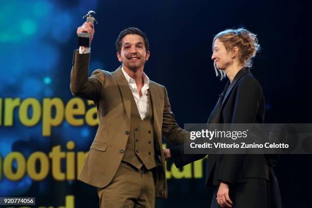 Matteo Simoni accepts the award from Alba Rohrwacher on stage at the European Shooting Stars 2018 award ceremony and '3 Days in Quiberon' premiere...