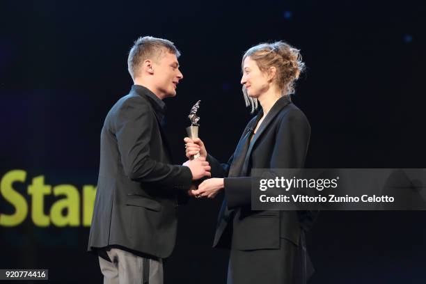 Jonas Smulders accepts the award from Alba Rohrwacher on stage at the European Shooting Stars 2018 award ceremony and '3 Days in Quiberon' premiere...